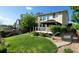 A home featuring a backyard with lush green grass and a gazebo, perfect for outdoor relaxation at 5049 Heatherglen Dr, Highlands Ranch, CO 80130