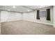 Finished basement featuring neutral carpet, recessed lighting, and a window for some natural light at 5049 Heatherglen Dr, Highlands Ranch, CO 80130