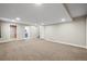 Finished basement featuring neutral carpet, recessed lighting and access doors to other spaces at 5049 Heatherglen Dr, Highlands Ranch, CO 80130