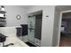 Modern bathroom featuring a glass-enclosed shower, floating shelves, and sleek fixtures at 5049 Heatherglen Dr, Highlands Ranch, CO 80130