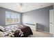 Bedroom featuring a decorative dresser, fan, and neutral walls and carpet at 5049 Heatherglen Dr, Highlands Ranch, CO 80130