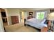 Well-lit main bedroom featuring neutral colors and view to the hall at 5049 Heatherglen Dr, Highlands Ranch, CO 80130