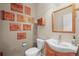 Cozy powder room with unique wall decor and a modern vanity at 5049 Heatherglen Dr, Highlands Ranch, CO 80130