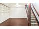 Basement space includes built-in shelving and staircase, perfect for customization at 6891 W Eldorado Pl, Lakewood, CO 80227
