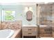 Bathroom featuring a modern vanity, shower, and soaking tub with neutral wall and floor tones at 6891 W Eldorado Pl, Lakewood, CO 80227