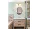Bathroom featuring a stylish vanity with quartz countertop, shaker cabinets and modern fixtures at 6891 W Eldorado Pl, Lakewood, CO 80227