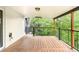 Covered deck overlooking lush greenery offers an outdoor retreat and relaxation space at 6891 W Eldorado Pl, Lakewood, CO 80227