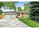 Charming single-story home with a well-manicured lawn, two-car garage, and appealing curb appeal at 6891 W Eldorado Pl, Lakewood, CO 80227