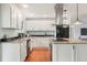 Bright and spacious kitchen with modern appliances, granite countertops, and ample cabinet space at 6891 W Eldorado Pl, Lakewood, CO 80227
