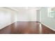 Spacious living room featuring beautiful hardwood floors, fresh paint, and natural light at 6891 W Eldorado Pl, Lakewood, CO 80227