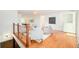 Open-concept living area with hardwood floors and dining room visible at 6891 W Eldorado Pl, Lakewood, CO 80227