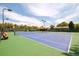 Multiple outdoor tennis courts, offering a well-maintained surface for recreational play with green surroundings at 6891 W Eldorado Pl, Lakewood, CO 80227