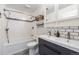 Updated bathroom featuring a double sink vanity and combined tub and shower at 709 2Nd St, Golden, CO 80403