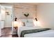 Cozy bedroom featuring a wood accent wall, soft lighting, and inviting decor at 709 2Nd St, Golden, CO 80403
