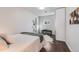 Well-lit bedroom with a modern bench, shelving unit, and minimalist design at 709 2Nd St, Golden, CO 80403