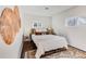 Bright bedroom with a decorative wall piece, neutral tones, and bedside tables at 709 2Nd St, Golden, CO 80403
