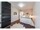 Stylishly decorated bedroom with a modern accent wall and sleek, mirrored closet at 709 2Nd St, Golden, CO 80403