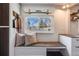 Bright entryway with custom bench, storage, and natural light from the window at 709 2Nd St, Golden, CO 80403