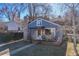 Charming single Gathering home featuring a stone chimney and a cozy covered front porch with seating at 709 2Nd St, Golden, CO 80403