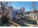 Charming home featuring a stone chimney, blue siding, and cozy front porch with seating at 709 2Nd St, Golden, CO 80403