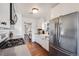 Updated kitchen with stainless steel appliances and a farmhouse sink at 709 2Nd St, Golden, CO 80403