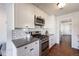 Bright white updated kitchen with stainless steel appliances, subway tile and hardwood floors at 709 2Nd St, Golden, CO 80403