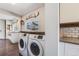 Mudroom with a washer and dryer, bench seating and storage cabinet at 709 2Nd St, Golden, CO 80403
