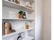 Built-in shelves featuring stylish décor items, books, and plants at 709 2Nd St, Golden, CO 80403