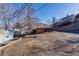 View of the yard showcasing a shed and the home's exterior features at 709 2Nd St, Golden, CO 80403