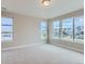 Spacious bedroom with neutral carpeting and large windows at 1765 Peak Loop, Broomfield, CO 80023