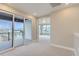 Bedroom with access to a private deck and city views at 1765 Peak Loop, Broomfield, CO 80023