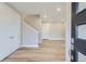 Bright and airy entryway with hardwood floors and staircase at 1765 Peak Loop, Broomfield, CO 80023