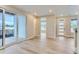 Light and airy entryway with hardwood floors and modern door at 1765 Peak Loop, Broomfield, CO 80023