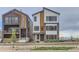 Two modern townhouses with sleek design and landscaping at 1765 Peak Loop, Broomfield, CO 80023