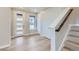 Modern foyer with light hardwood floors and storage at 1765 Peak Loop, Broomfield, CO 80023