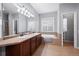 Elegant bathroom with dual sinks, a soaking tub, and a separate shower at 4067 S Odessa St, Aurora, CO 80013