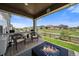 Cozy back porch with a fire pit and comfortable seating, perfect for relaxing at 848 Sandstone Cir, Erie, CO 80516