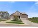 Charming two-story home with a well-manicured lawn and a three-car garage at 848 Sandstone Cir, Erie, CO 80516