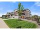 Attractive home with a well-manicured lawn, two-car garage, and inviting curb appeal at 848 Sandstone Cir, Erie, CO 80516