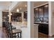 Kitchen with quartz countertops, stainless steel appliances, stylish backsplash, and bar stool seating at 848 Sandstone Cir, Erie, CO 80516