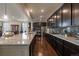 Spacious kitchen featuring stainless steel appliances, ample counter space, and dark wood cabinetry at 848 Sandstone Cir, Erie, CO 80516