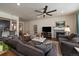 Cozy living room with a stone fireplace and plush seating at 848 Sandstone Cir, Erie, CO 80516