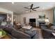 Comfortable living room with modern furnishings, fireplace, and an open layout, perfect for entertaining at 848 Sandstone Cir, Erie, CO 80516