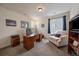 Well-lit home office with a large desk, comfortable chair, and ample natural light at 848 Sandstone Cir, Erie, CO 80516