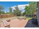 Backyard featuring a wood deck with built-in benches and green grass at 11337 E 1St Ave, Aurora, CO 80010