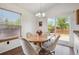 Cozy dining room with bright natural light and a sliding glass door to the patio at 11337 E 1St Ave, Aurora, CO 80010