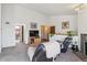 View of the living room showcases an open floor plan and easy access to the bathroom at 11337 E 1St Ave, Aurora, CO 80010