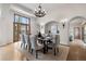 Elegant dining room with modern chandelier, large windows, and views of living spaces at 4525 King St, Denver, CO 80211