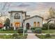 Gorgeous two-story stucco house with arched windows, wrought iron accents and beautiful landscaping at 4525 King St, Denver, CO 80211