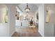 Inviting entryway with arched doorways and views of the living room, dining room, and staircase at 4525 King St, Denver, CO 80211
